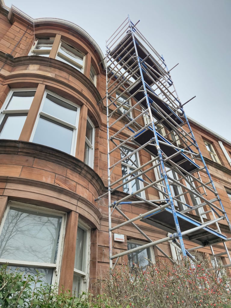 Scaffolding on the facade of an old historical tenement flats, Glasgow Scotland